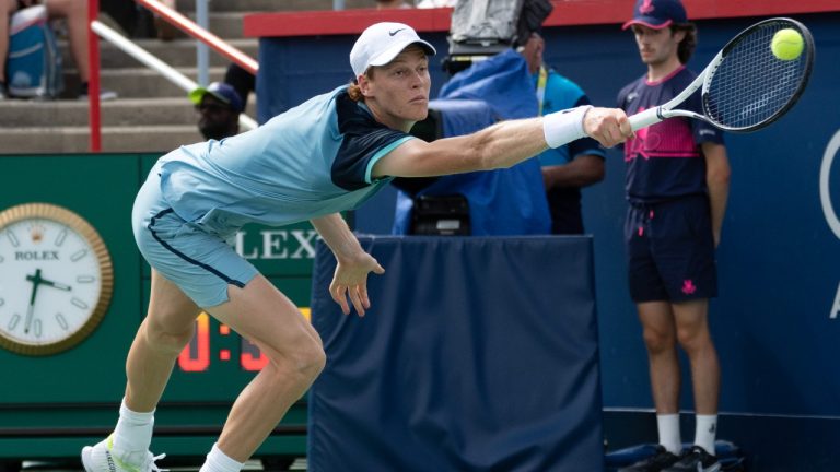 Italy's Jannik Sinner lunges for a shot from Croatia's Borna Coric during their second round match at the National Bank Open tennis Thursday, August 8, 2024 in Montreal. (Ryan Remiorz/CP)