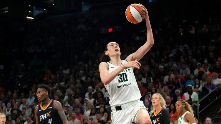 New York Liberty forward Breanna Stewart (30) drives past Phoenix Mercury forward Natasha Mack (4) to score during the first half of a WNBA basketball game Monday, Aug. 26, 2024, in Phoenix. (Ross D. Franklin/AP)