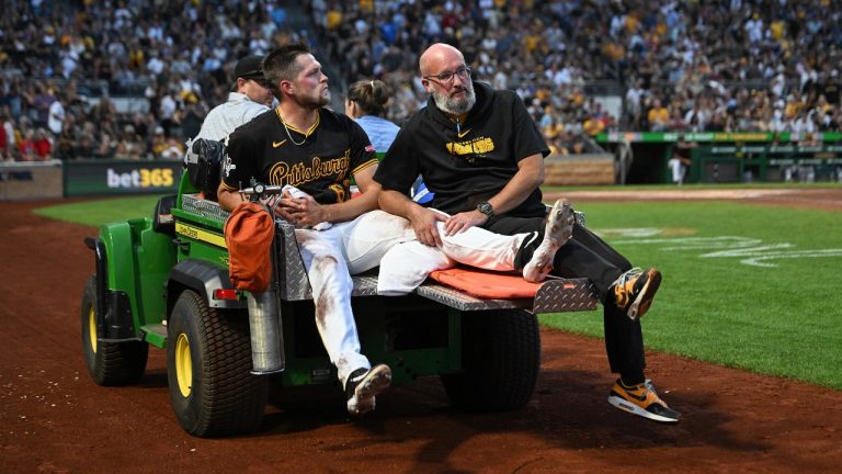 Pittsburgh Pirates pitcher Hunter Stratton, left, is taken from the field after getting injured in the fourth inning of a baseball game against the Cincinnati Reds, Saturday, Aug. 24, 2024, in Pittsburgh. (Barry Reeger/AP)