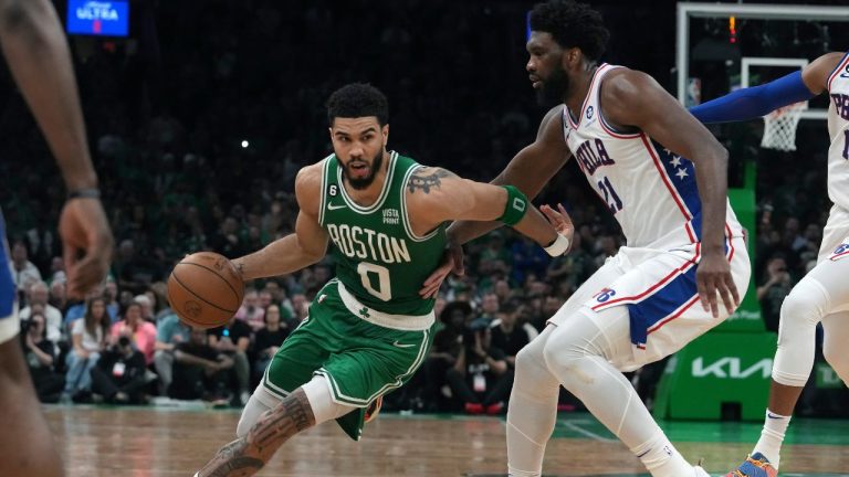 Boston Celtics forward Jayson Tatum drives past Philadelphia 76ers center Joel Embiid during the second half of Game 7 in the NBA basketball Eastern Conference semifinals playoff series, Sunday, May 14, 2023, in Boston. (Steven Senne/AP Photo)