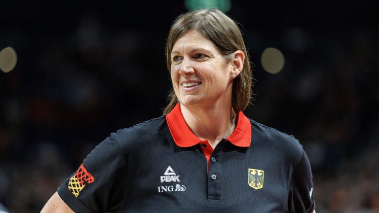 Germany national coach Lisa Thomaidis smiles during the Women International Basketball match between Germany and Nigeria at the Uber Arena in Berlin, Friday July 19, 2024. (Andreas Gora/dpa via AP)