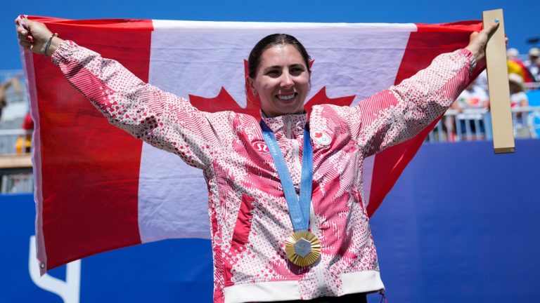 Katie Vincent, of Canada, poses with the gold medal in the women's canoe single 200-metre finals at the 2024 Summer Olympics, Saturday, Aug. 10, 2024, in Vaires-sur-Marne, France. (Ebrahim Noroozi/AP Photo)