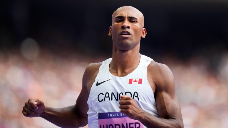 Damian Warner, of Canada, wins a heat in the decathlon 100-meter run at the 2024 Summer Olympics, Friday, Aug. 2, 2024, in Saint-Denis, France. (Petr David Josek/AP Photo)