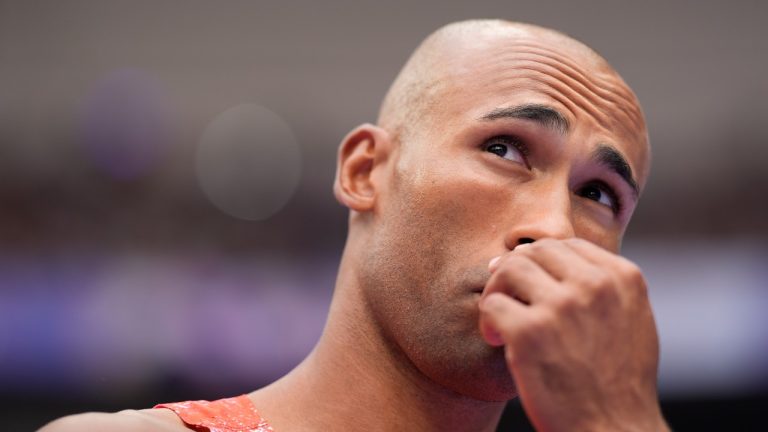 Damian Warner, of Canada, reacts in the decathlon discus throw at the 2024 Summer Olympics, Saturday, Aug. 3, 2024, in Saint-Denis, France. (Matthias Schrader/AP Photo)