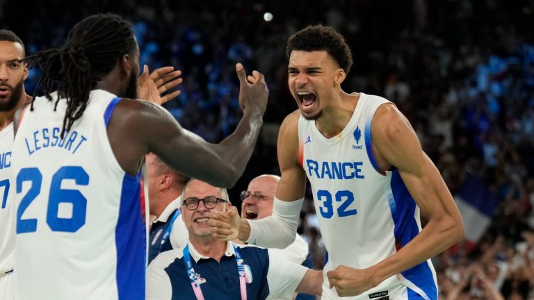 Mathias Lessort (26), of France and Victor Wembanyama (32), of France celebrate after beating Germany during a men's semifinals basketball game at Bercy Arena at the 2024 Summer Olympics, Thursday, Aug. 8, 2024, in Paris, France. (Mark J. Terrill/AP Photo)