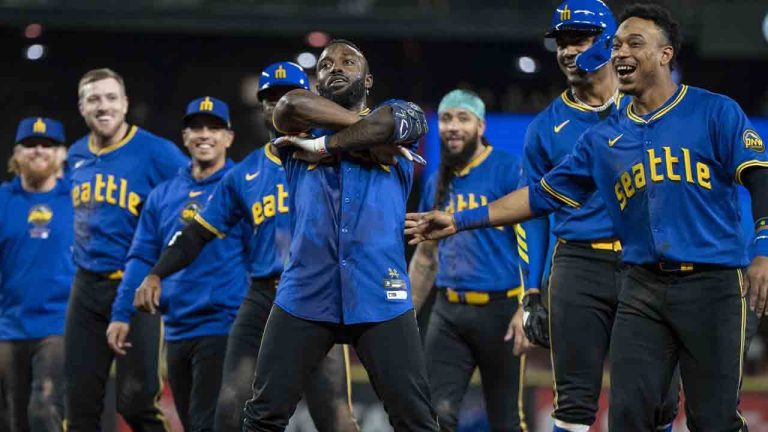 Seattle Mariners' Randy Arozarena, center, celebrates with teammates including Jorge Polanco, far right, and Julio Rodriguez, second from right, after a baseball game against the Texas Rangers, Saturday, Sept. 14, 2024, in Seattle. (Stephen Brashear/AP)