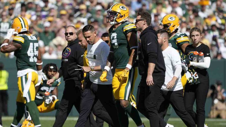 Green Bay Packers wide receiver Christian Watson (9) is helped off the after being injured during the first half of an NFL football game against the Minnesota Vikings, Sunday, Sept. 29, 2024, in Green Bay, Wis. (Morry Gash/AP)