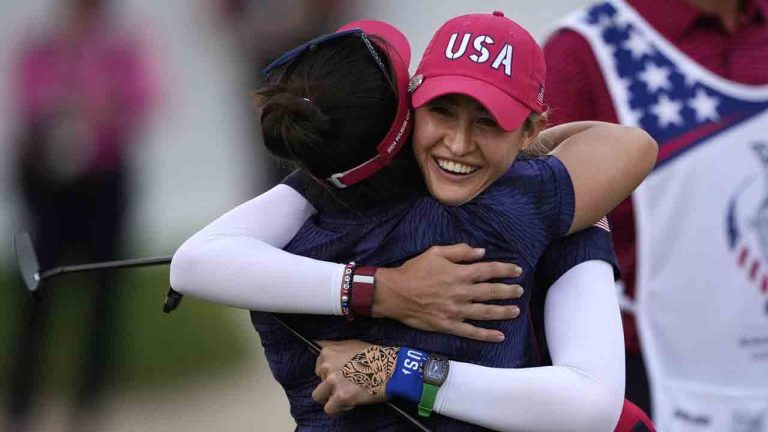 United States' Nelly Korda, right, and teammate Megan Khang hug while celebrating their victory during a Solheim Cup golf tournament fourball match at Robert Trent Jones Golf Club, Friday, Sept. 13, 2024, in Gainesville, Va. (Matt York/AP)