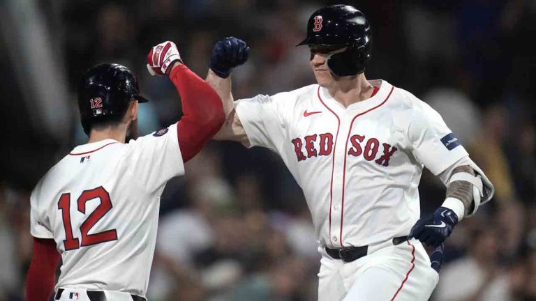 Boston Red Sox's Tyler O'Neill, right, is congratulated by Connor Wong (12) after his solo home run off Baltimore Orioles pitcher Cade Povich during the third inning of a baseball game at Fenway Park, Monday, Sept. 9, 2024, in Boston. (Charles Krupa/AP)