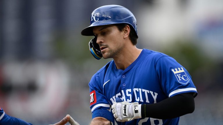 Kansas City Royals' Adam Frazier reacts at first base after his single drove in two runs during the ninth inning of a baseball game against the Washington Nationals, Thursday, Sept. 26, 2024, in Washington. The Royals won 7-4. (AP/Nick Wass)