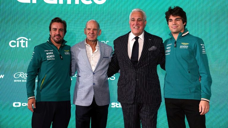 Aston Martin Aramco Formula One Team drivers, Fernando Alonso, left, and Lance Stroll, right, pose with Adrian Newey, second left, newly appointed managing technical partner and Lawrence Stroll, second right, Executive Chairman, during a press conference at the AMF1 Team Technology Campus, Silverstone, Northamptonshire, England, Tuesday Sept. 10, 2024. (Bradley Collyer/PA via AP)