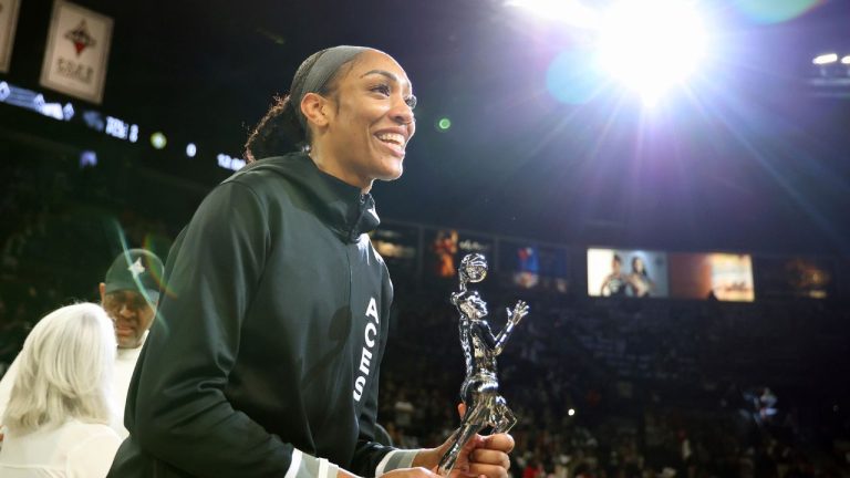 Las Vegas Aces centre A'ja Wilson (22) receives the 2024 WMBA MVP award prior to playing in a first-round WNBA basketball playoff game against the Seattle Storm Sunday, Sept. 22, 2024, in Las Vegas. (Ronda Churchill/AP Photo)