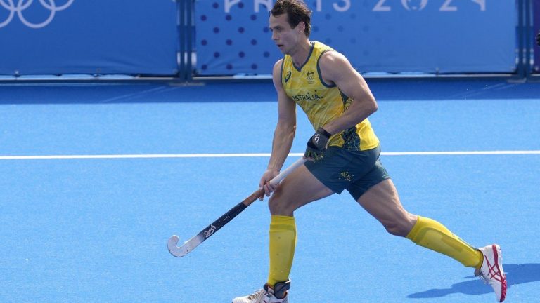 Australia's Thomas Craig runs with the ball during the men's field hockey match between Australia and New Zealand at the Yves-du-Manoir Stadium, at the 2024 Summer Olympics, Thursday, Aug. 1, 2024, in Colombes, France. (AP Photo/Anjum Naveed)