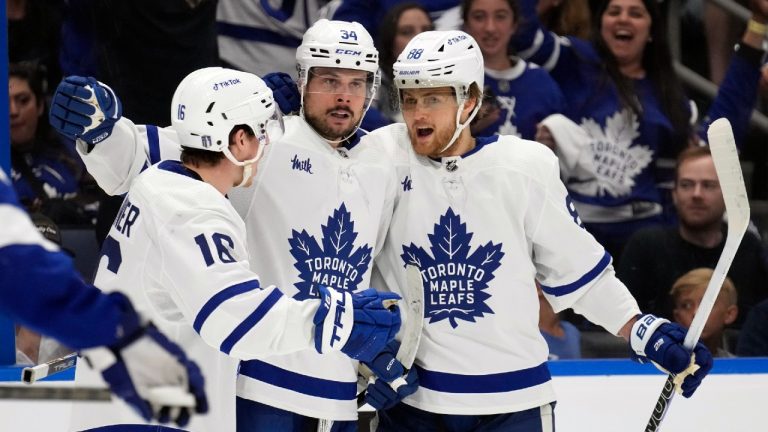 Toronto Maple Leafs centre Auston Matthews (34) celebrates his goal against the Tampa Bay Lightning with right wing William Nylander (88) and right wing Mitchell Marner (16). (Chris O'Meara/AP)