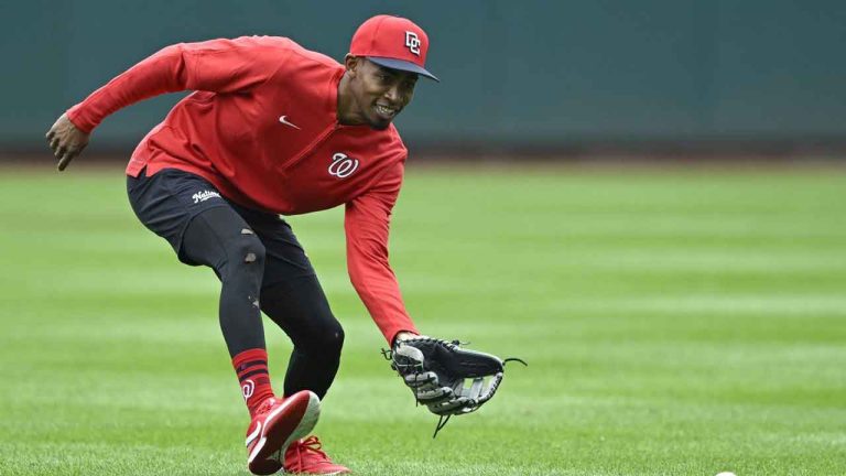 Washington Nationals' Darren Baker fields a grounder during outfield practice after being called up from the minor leagues before a baseball game against the Chicago Cubs. (John McDonnell/AP)