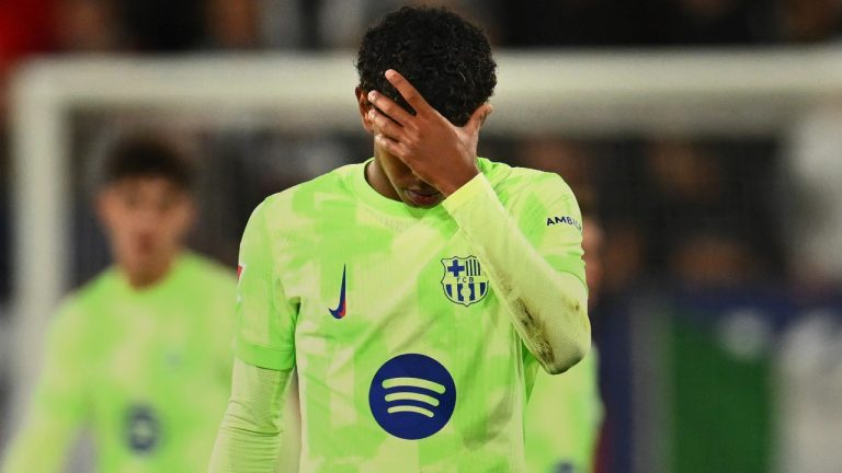 Barcelona's Lamine Yamal reacts at the end of a Spanish La Liga soccer match after loosing against Osasuna at El Sadar stadium in Pamplona, Spain, Saturday, Sept. 28, 2024. (AP Photo/Miguel Oses)