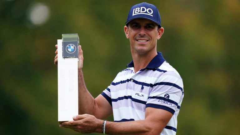 Billy Horschel of the U.S. displays the trophy following day four of the PGA Championship at Wentworth Golf Club in Virginia Water, England, Sunday Sept. 22, 2024. (Zac Goodwin/PA via AP)