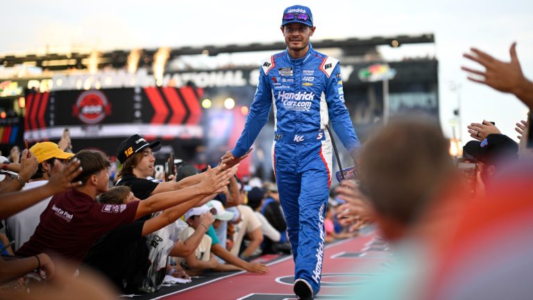 Kyle Larson (5) interacts with spectators while walking down a runway during driver introductions before a NASCAR Cup Series auto race at Daytona International Speedway, Saturday, Aug. 24, 2024, in Daytona Beach, Fla. (Phelan M. Ebenhack/AP) 