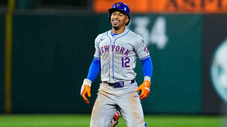 New York Mets' Francisco Lindor smiles after he was tagged out by Philadelphia Phillies' Trea Turner while trying to advance to third base during the sixth inning of a baseball game, Friday, Sept. 13, 2024, in Philadelphia. (Derik Hamilton/AP)