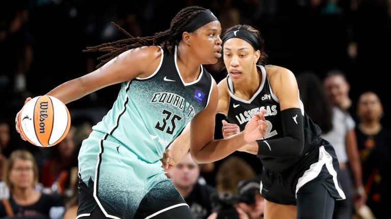 New York Liberty forward Jonquel Jones (35) drives against Las Vegas Aces center A'ja Wilson, right, during the first half of a WNBA basketball game Saturday, Aug. 17, 2024, in Las Vegas. (Steve Marcus/Las Vegas Sun via AP) 