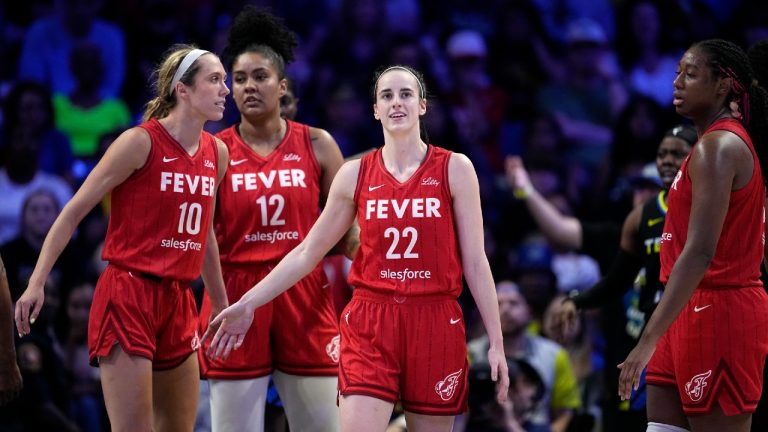 Indiana Fever's Caitlin Clark (22) celebrates with Lexie Hull (10), Damiris Dantas (12) and Aliyah Boston, right, during a WNBA basketball game against the Dallas Wings Sunday, Sept. 1, 2024, in Arlington, Texas. (Tony Gutierrez/AP)