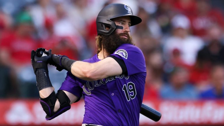 Colorado Rockies' Charlie Blackmon (19) swings his bat while on deck during the fourth inning of a baseball game against the Los Angeles Angels in Anaheim, Calif., Tuesday, July 30, 2024. (AP Photo/Jessie Alcheh)