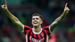 AC Milan's Christian Pulisic celebrates after scoring his side's third goal during the Serie A soccer match between AC Milan and Lecce at the San Siro stadium in Milan, Italy, Friday, Sept. 27, 2024. (Spada/LaPresse/AP)