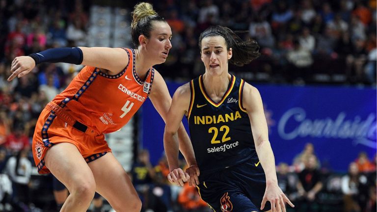 Connecticut Sun's Marina Mabrey (4) guards against Indiana Fever's Caitlin Clark (22) during a first-round WNBA basketball playoff game at Mohegan Sun Arena, Sunday, Sept. 22, 2024. (Sarah Gordon/The Day via AP)