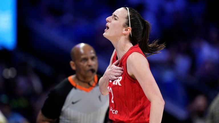 Indiana Fever's Caitlin Clark celebrates after sinking a three-point basket during a WNBA basketball game against the Dallas Wings Sunday, Sept. 1, 2024, in Arlington, Texas. (Tony Gutierrez/AP Photo)