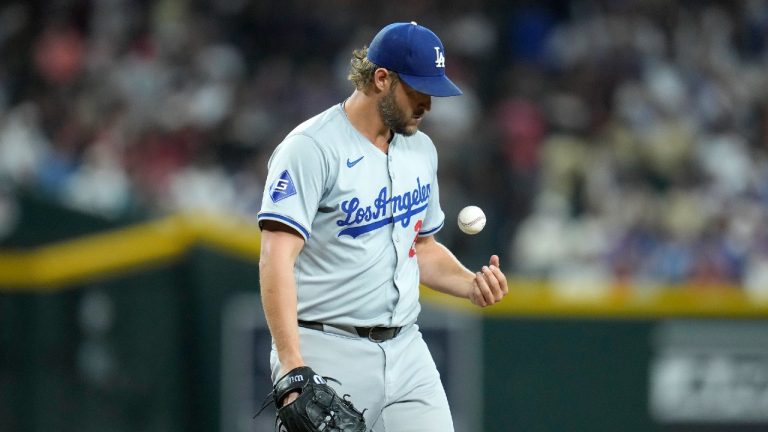 Los Angeles Dodgers starting pitcher Clayton Kershaw flips the ball in the air during the first inning of a baseball game against the Arizona Diamondbacks Friday, Aug. 30, 2024, in Phoenix. (Ross D. Franklin/AP)