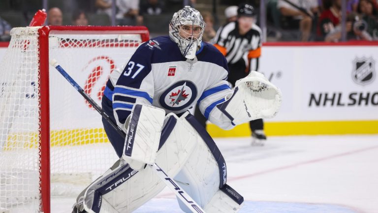 Winnipeg Jets goaltender Connor Hellebuyck (37) focuses on the play during the first period of a preseason NHL hockey game against the Minnesota Wild, Friday, Sept. 27, 2024, in St. Paul, Minn. (Bailey
Hillesheim/AP)