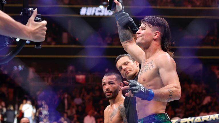 Diego Lopes, right, is declared the winner by unanimous decision over Dan Ige in a 165-pound catchweight mixed martial arts bout at UFC 303 in Las Vegas. Ige replaced Brian Ortega, who withdrew from the bout due to illness. (Steve Marcus/Las Vegas Sun via AP)