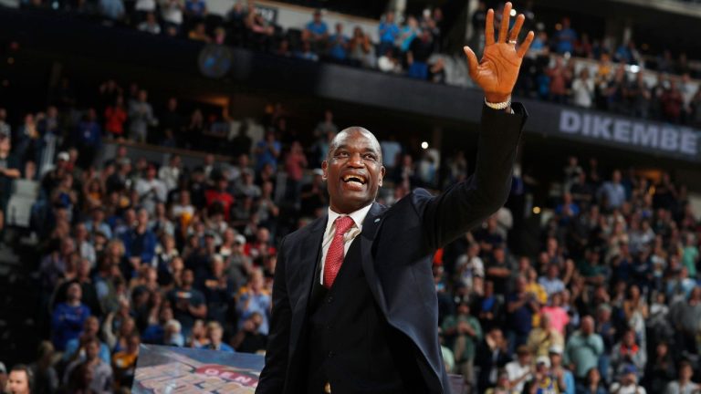 Retired Denver Nuggets center Dikembe Mutombo waves to the crowd as his jersey number was retired by the team during halftime of the Nuggets' NBA basketball game against the Portland Trail Blazers on Saturday, Oct. 29, 2016, in Denver. Portland won 115-113 in overtime. (David Zalubowski/AP Photo)