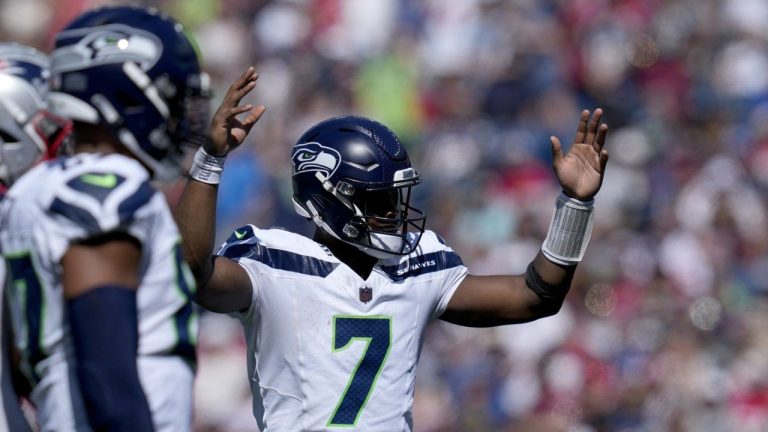 Seattle Seahawks quarterback Geno Smith (7) celebrates after running back Zach Charbonnet rushed for a touchdown in the first half of an NFL football game against the New England Patriots, Sunday, Sept. 15, 2024, in Foxborough, Mass. (Charles Krupa/AP Photo)
