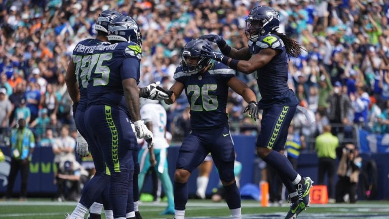 Seattle Seahawks running back Zach Charbonnet (26) reacts after scoring a touchdown during the first half of an NFL football game against the Miami Dolphins, Sunday, Sept. 22, 2024, in Seattle. (Lindsey Wasson/AP Photo)
