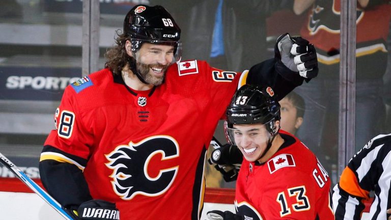 Calgary Flames' Jaromir Jagr celebrates his first goal as a Calgary Flame with teammate Johnny Gaudreau during second period NHL hockey action against the Detroit Red Wings, in Calgary on Thursday, Nov. 9, 2017. (Jeff McIntosh/CP Photo)