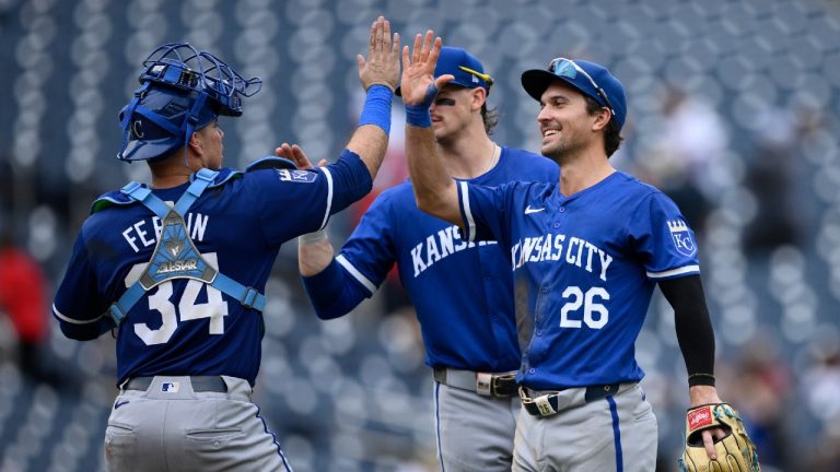 Kansas City Royals catcher Freddy Fermin (34), Adam Frazier (26) and Bobby Witt Jr., back, celebrate after a baseball game against the Washington Nationals, Thursday, Sept. 26, 2024, in Washington. The Royals won 7-4. (Nick Wass/AP)