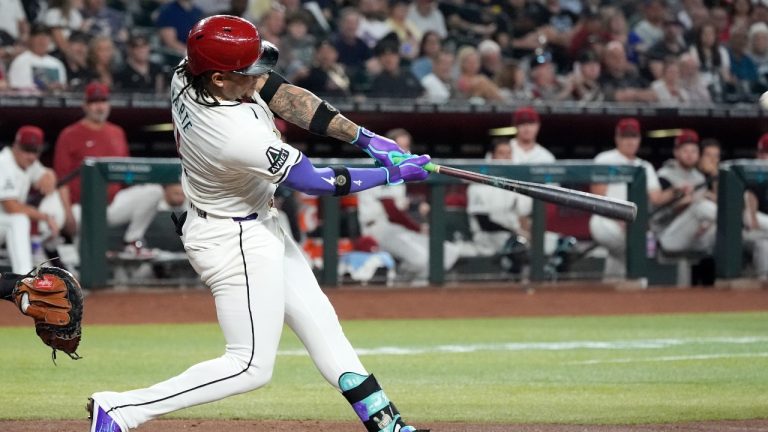 Arizona Diamondbacks' Ketel Marte connects for a three-run home run against the Texas Rangers during the fourth inning of a baseball game Wednesday, Sept. 11, 2024, in Phoenix. (AP/Ross D. Franklin)