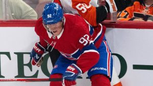 Montreal Canadiens Patrik Laine (92) checks Philadelphia Flyers Oliver Bonk (59) during second period NHL pre-season action. (Ryan Remiorz/CP)