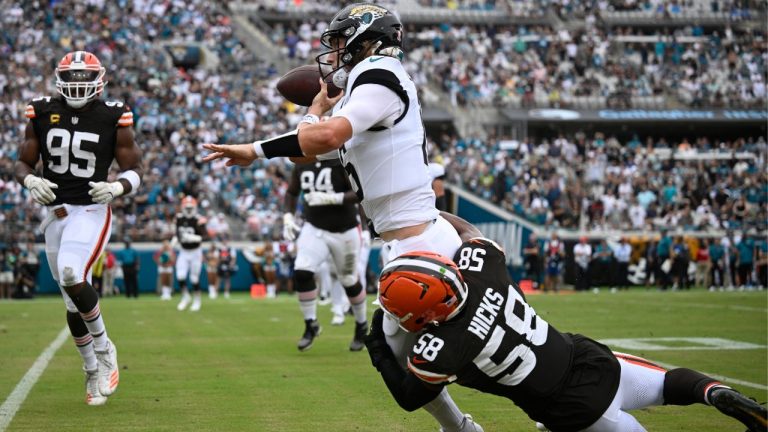 Jacksonville Jaguars quarterback Trevor Lawrence (16) tackled on a run. (AP)