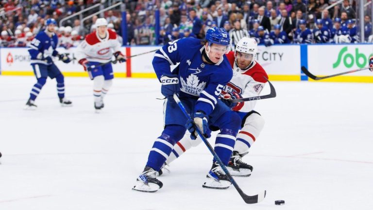 Montreal Canadiens' Jayden Struble (47) checks Toronto Maple Leafs' Easton Cowan (53) during second period pre-season NHL hockey action in Toronto on Thursday, September 26, 2024. (Cole Burston/CP Photo)
