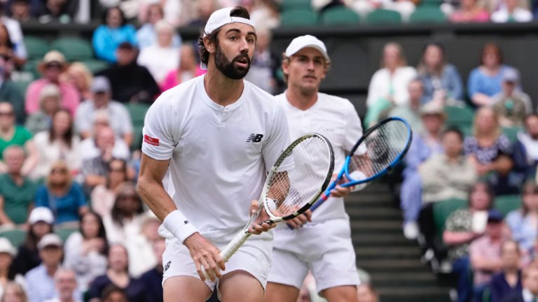 Australia's Max Purcell and compatriot Jordan Thompson, left, in action against Harri Heliovaara of Finland and Henry Patten of Britain in the men's doubles final at the Wimbledon tennis championships in London, Saturday, July 13, 2024. (Alberto Pezzali/AP)