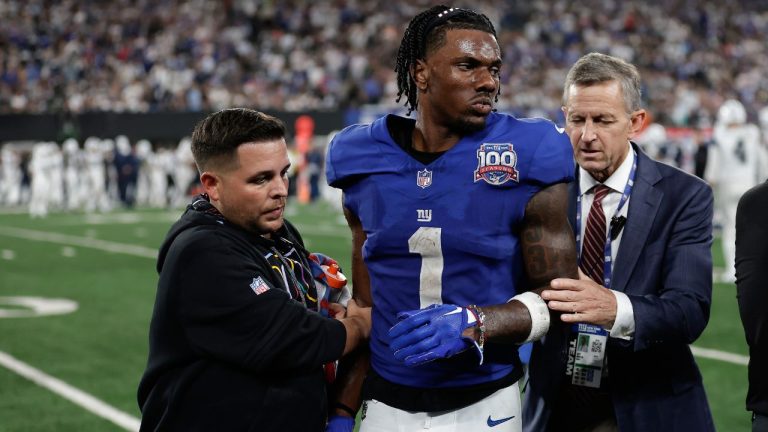 New York Giants wide receiver Malik Nabers (1) is helped off the field after an injury during the fourth quarter of an NFL football game against the Dallas Cowboys, Thursday, Sept. 26, 2024, in East Rutherford, N.J. (Adam Hunger/AP Photo)