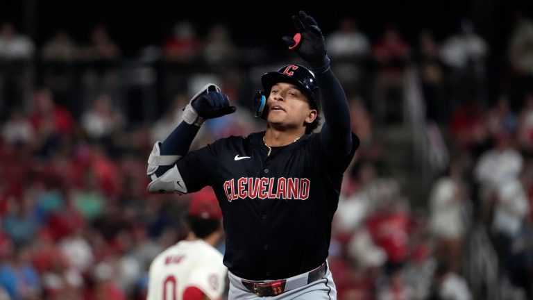 Cleveland Guardians' Bo Naylor celebrates as he rounds the bases after hitting a solo home run during the fifth inning of a baseball game against the St. Louis Cardinals. (Jeff Roberson/AP)