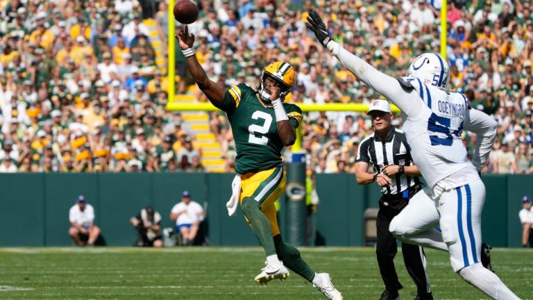 Green Bay Packers quarterback Malik Willis (2) throws on the run as Indianapolis Colts defensive end Dayo Odeyingbo (54) defends during the second half of an NFL football game Sunday, Sept. 15, 2024, in Green Bay, Wis. (Morry Gash/AP Photo)