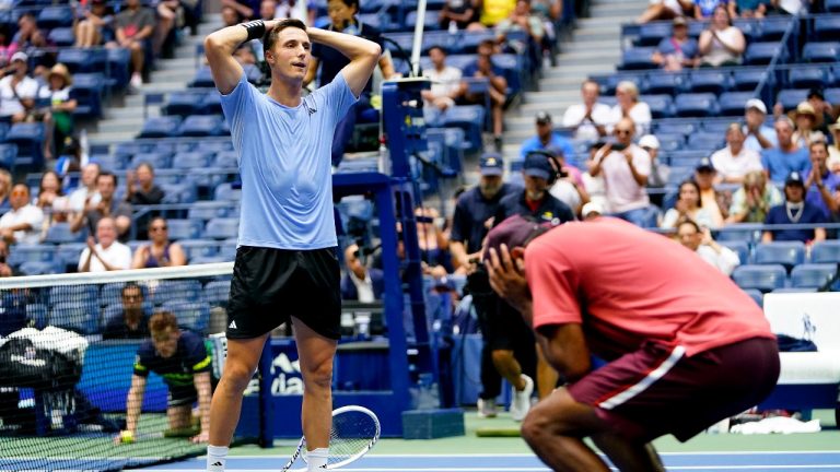 Joe Salisbury, of Great Britain, left, and Rajeev Ram, of the United States, react after defeating Rohan Bopanna, of India, and Matthew Ebden, of Australia, during the men's doubles final of the U.S. Open tennis championships, Friday, Sept. 8, 2023, in New York. (AP Photo/Frank Franklin II)