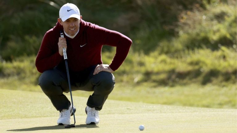 Northern Ireland's Rory McIlroy lines up his putts on the 5th green during day one of the Amgen Irish Open 2024 at Royal County Down in Newcastle, Ireland, Thursday Sept. 12, 2024. (Liam McBurney/PA via AP)
