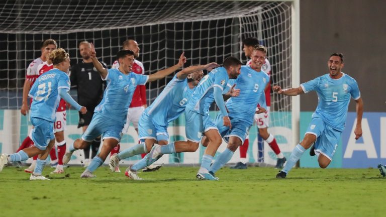 San Marino's Alessandro Golinucci, fourth from right, celebrates with his teammates after scoring his side's opening goal during the Euro 2024 group H qualifying soccer match between San Marino and Denmark at the San Marino Stadium in Serravalle, San Marino, Tuesday, Oct. 17, 2023. (AP/Felice Calabro)