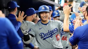 Los Angeles Dodgers' Shohei Ohtani (17) celebrates after hitting a home run during the sixth inning of a baseball game against the Miami Marlins, Thursday, Sept. 19, 2024, in Miami. (AP Photo/Marta Lavandier)