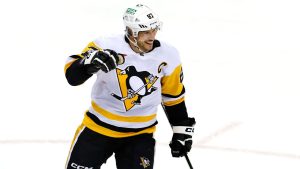 Pittsburgh Penguins centre Sidney Crosby smiles after scoring a goal against the New Jersey Devils during the third period of an NHL hockey game, Tuesday, April 2, 2024, in Newark, N.J. (Noah K. Murray/AP Photo)